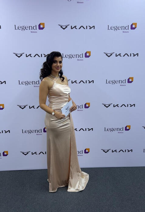 alt="MC Dija hosting car launch" alt="Bilingual emcee on stage for car launch"