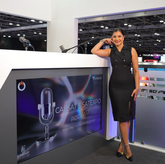 alt="MC Dija hosting Cabsat SatExpo event in Dubai" alt="Bilingual emcee on stage for Huawei corporate event"